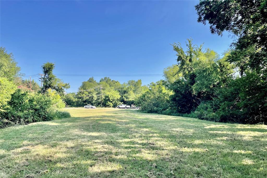 815 Culver Street Commerce, TX 75428 - Photo 3 of 4 a view of a field with an trees