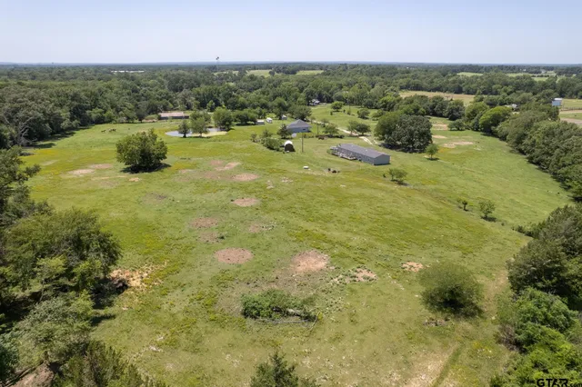a view of a lake with a yard