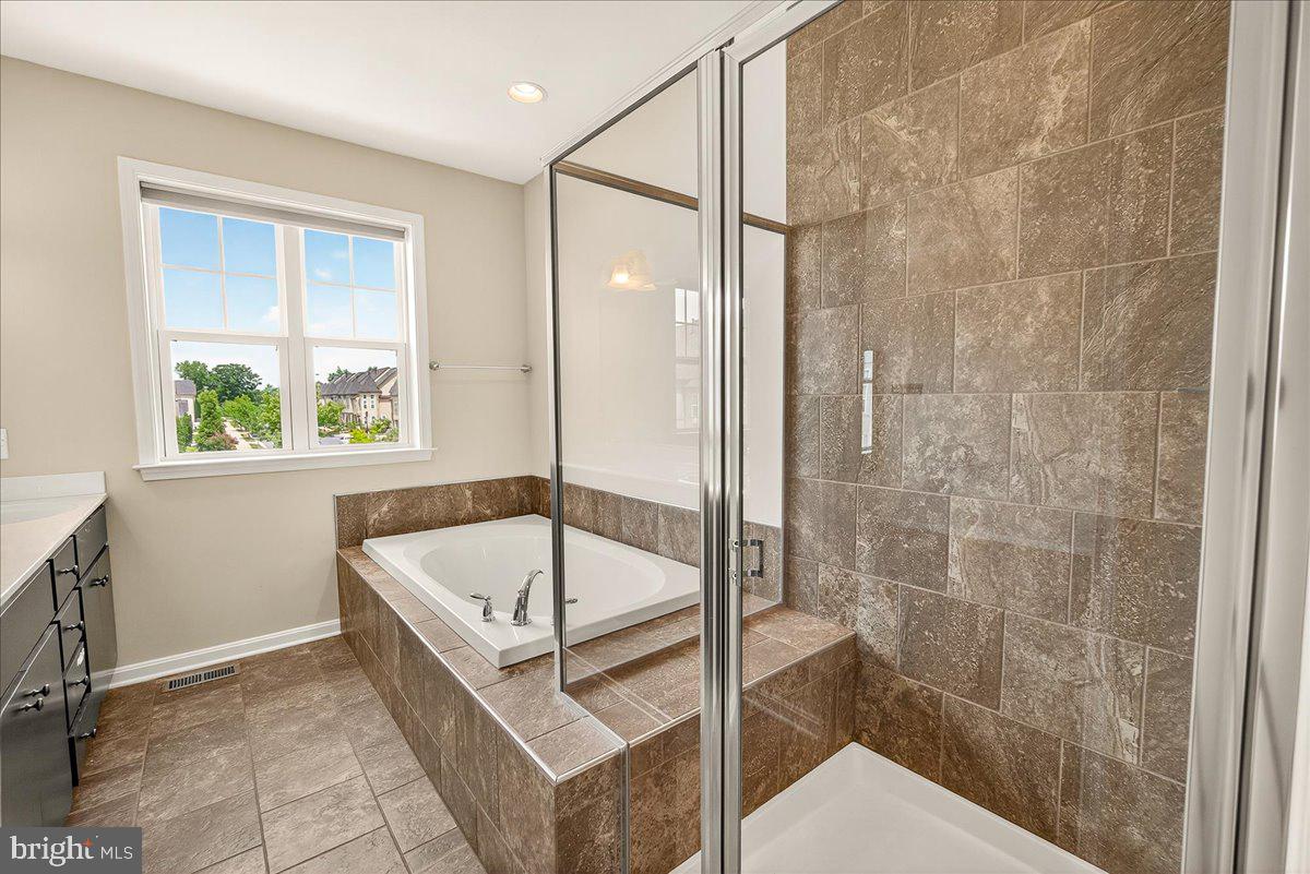519 Prieur Road Frederick, MD 21701 - Photo 21 of 77 a bathroom with a tub and a shower