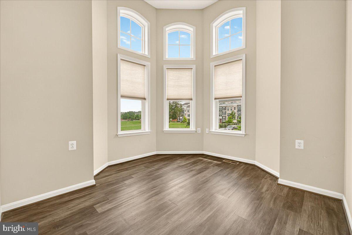 519 Prieur Road Frederick, MD 21701 - Photo 28 of 77 an empty room with wooden floor and windows