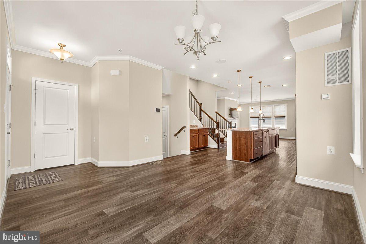 519 Prieur Road Frederick, MD 21701 - Photo 32 of 77 a view of a hallway with wooden floor