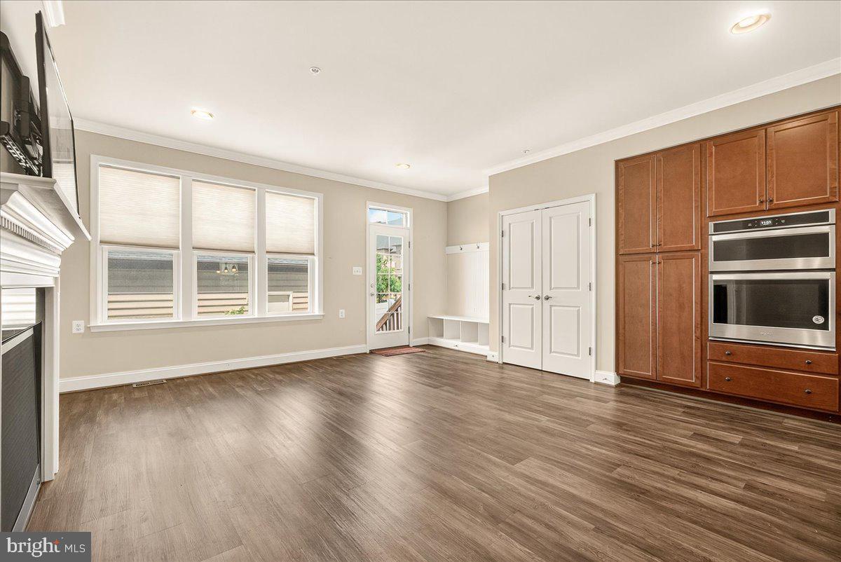 519 Prieur Road Frederick, MD 21701 - Photo 40 of 77 a view of an empty room with wooden floor and a window