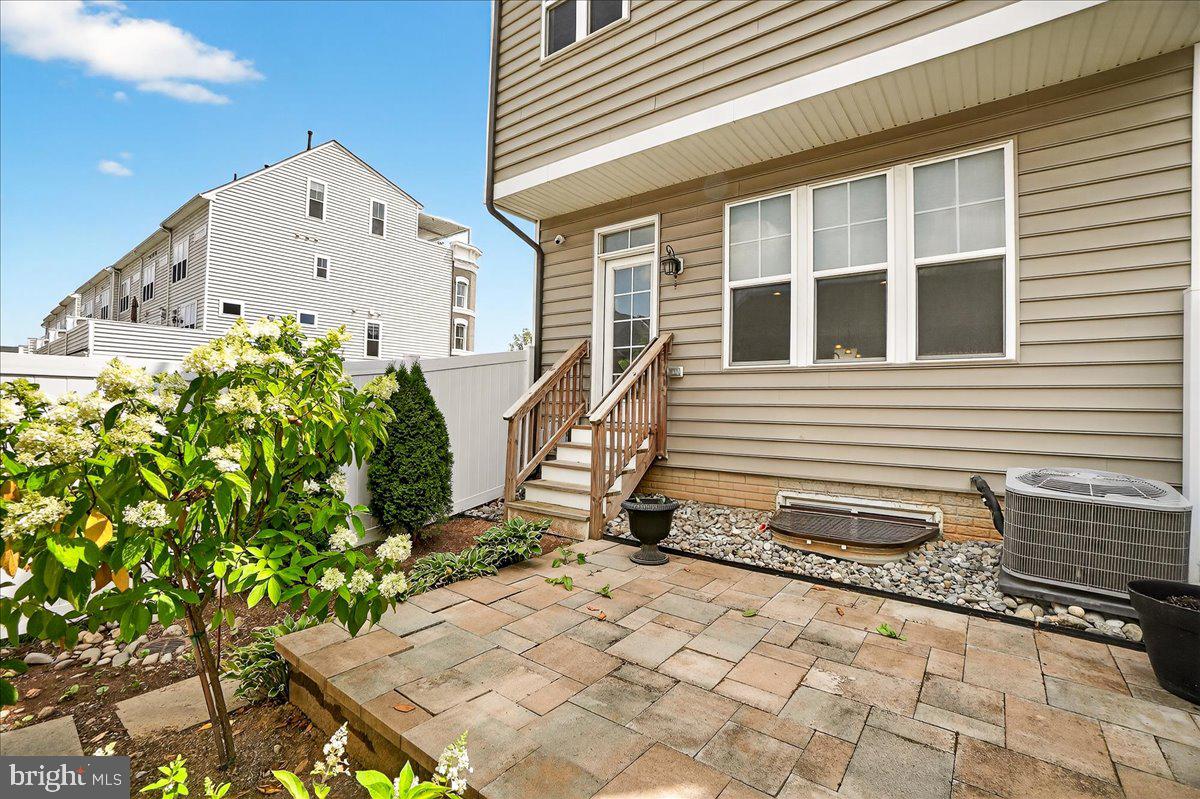 519 Prieur Road Frederick, MD 21701 - Photo 48 of 77 a front view of a house with a yard and potted plants