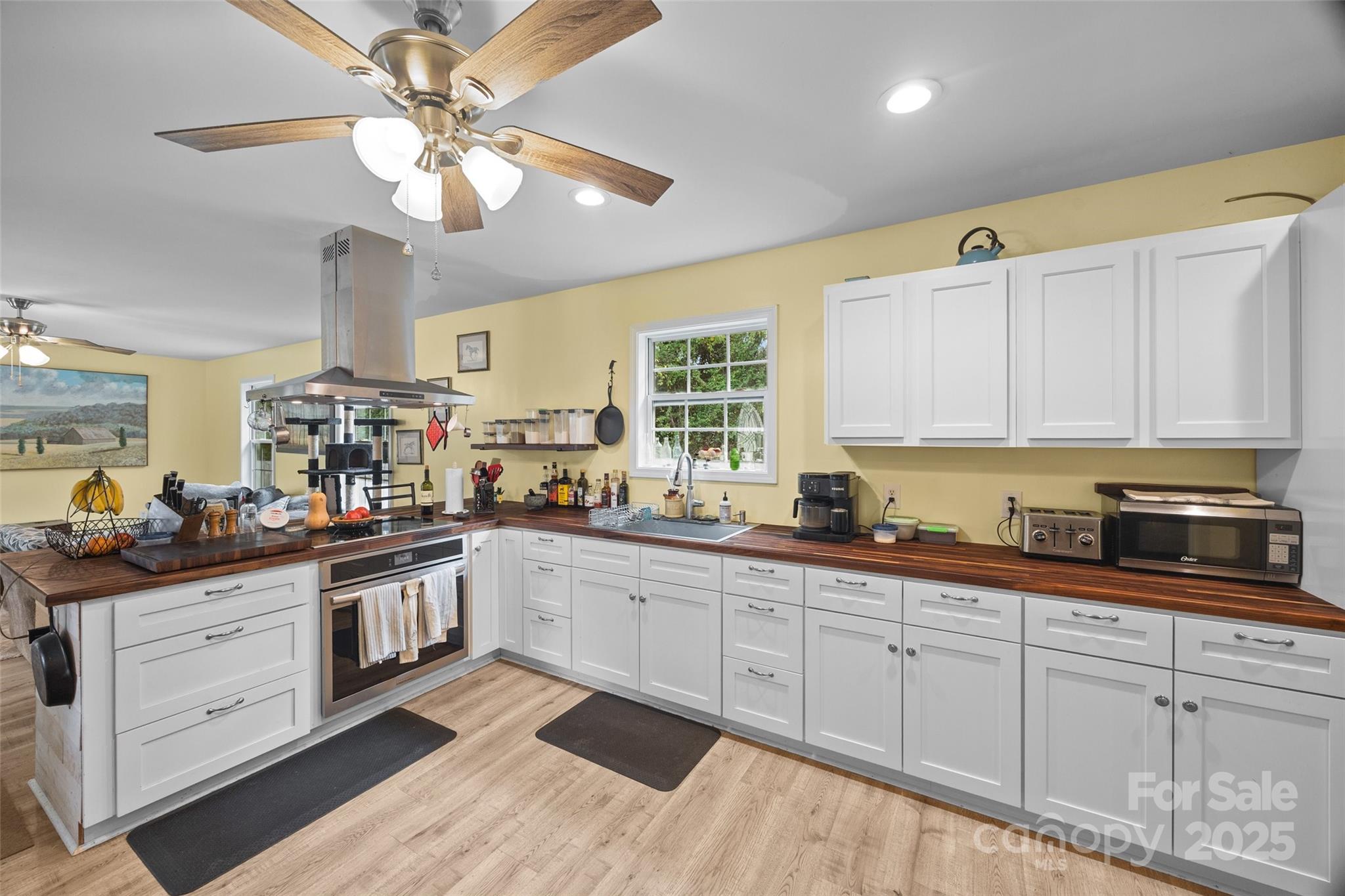1845 State Rd S-46-149 Clover, SC 29710 - Photo 12 of 48 a kitchen with stainless steel appliances granite countertop a sink and cabinets