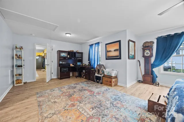 a view of a livingroom with furniture and window
