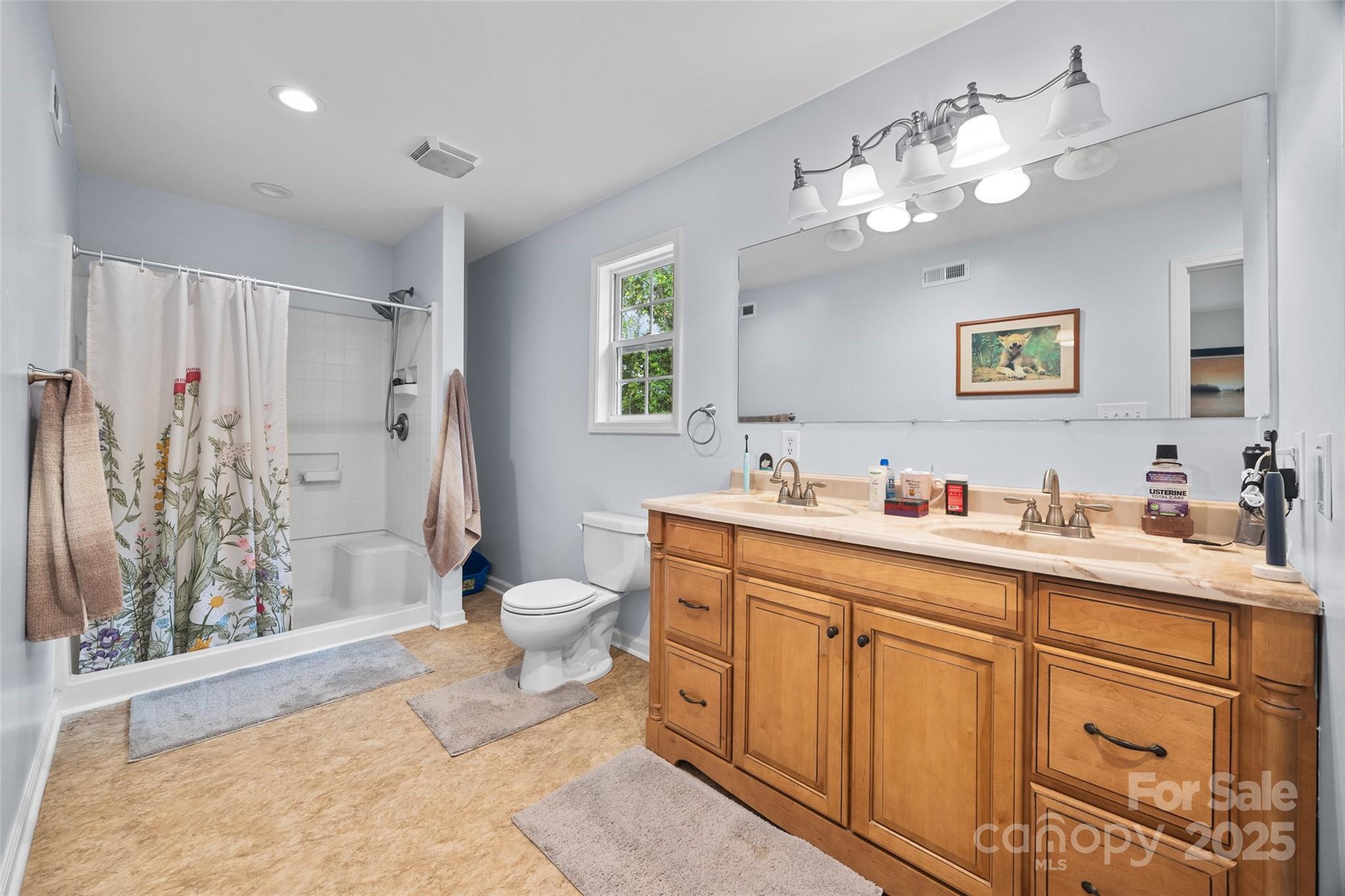 1845 State Rd S-46-149 Clover, SC 29710 - Photo 19 of 48 a spacious bathroom with a double vanity sink mirror and toilet