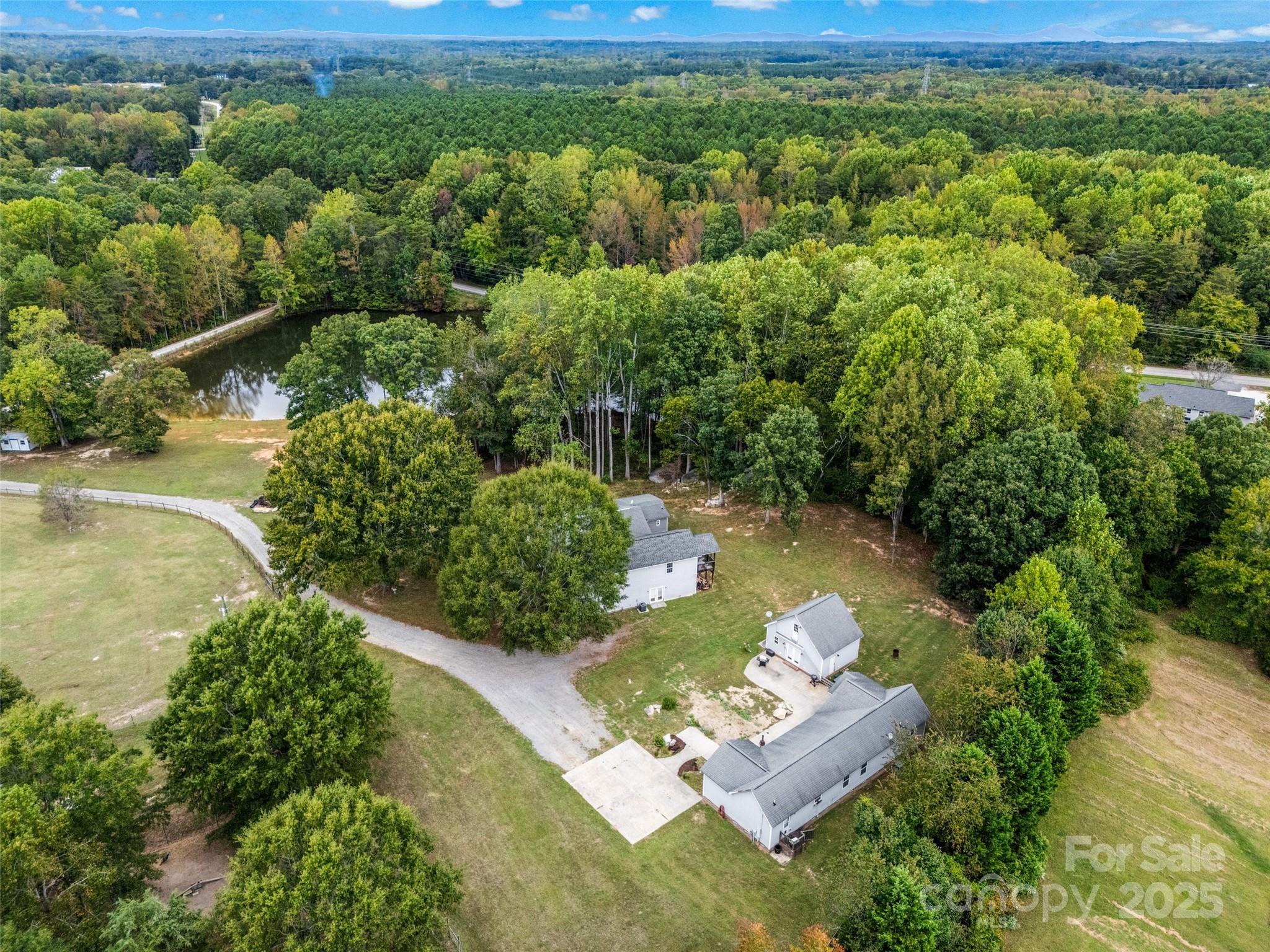 1845 State Rd S-46-149 Clover, SC 29710 - Photo 2 of 48 a view of a lake with a yard