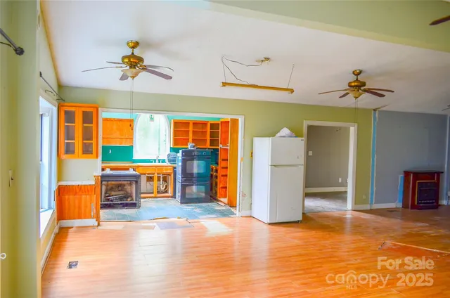 a view of a room with furniture and window