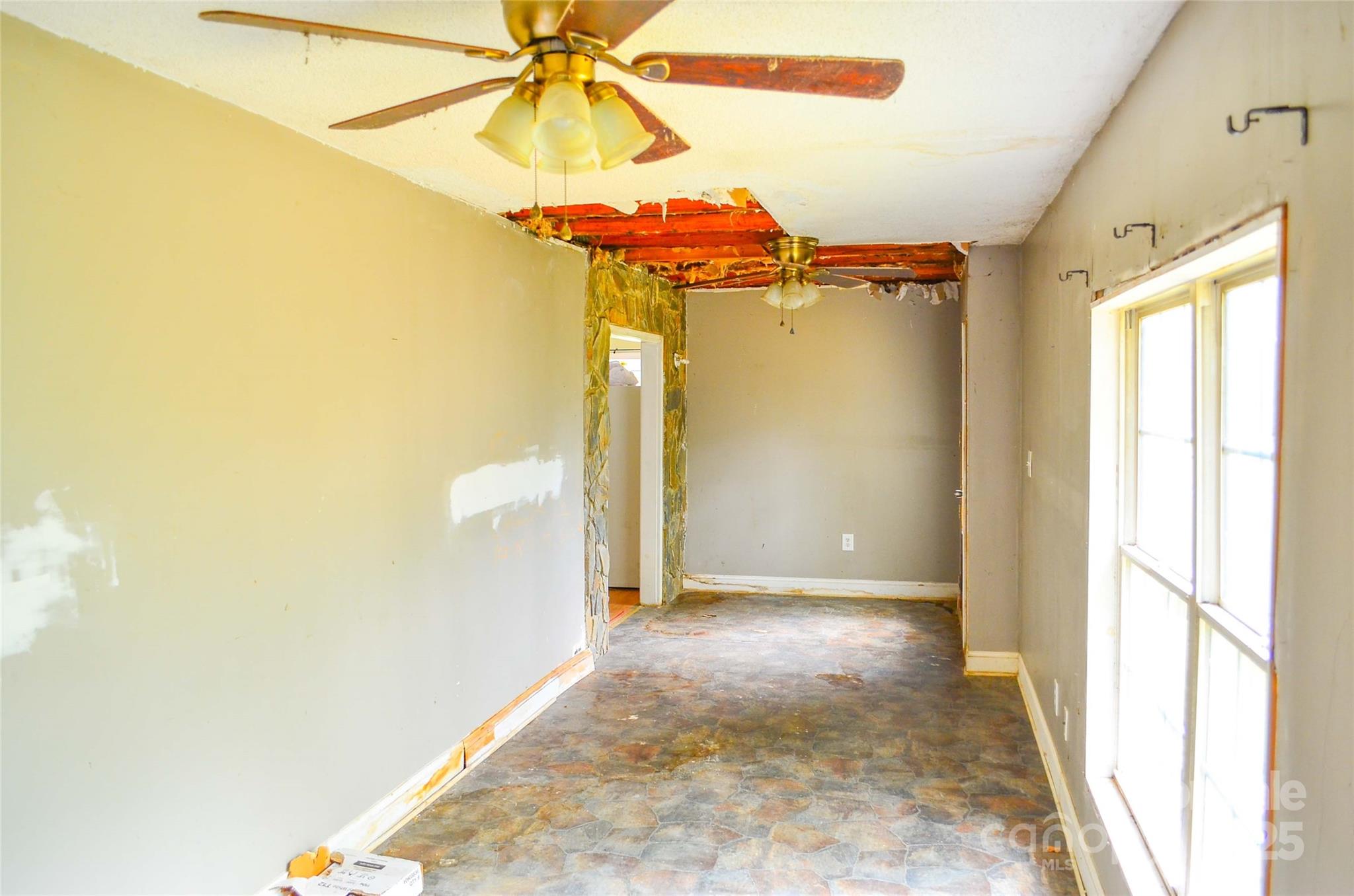 1845 State Rd S-46-149 Clover, SC 29710 - Photo 27 of 48 a view of a bedroom with a bed and a chandelier