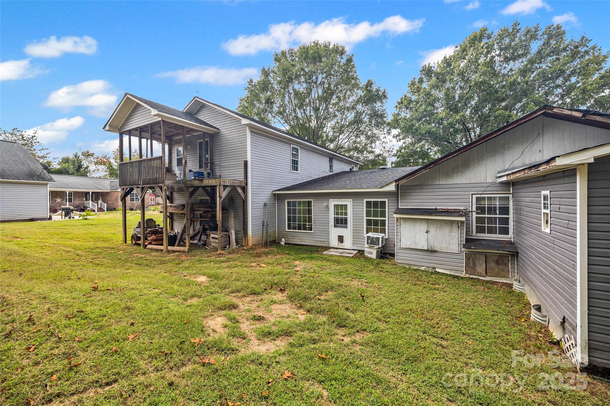 1845 State Rd S-46-149 Clover, SC 29710 - Photo 33 of 48 a view of a house with a backyard porch and sitting area