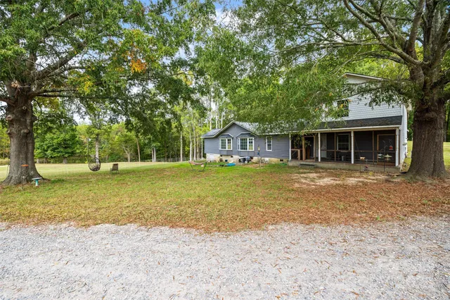 a house with trees in the background