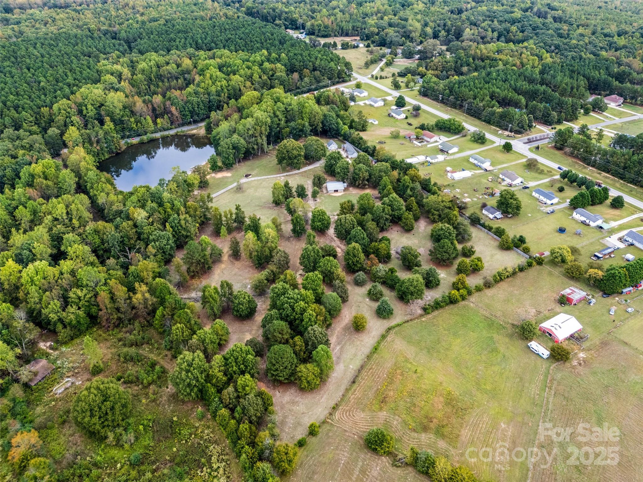 1845 State Rd S-46-149 Clover, SC 29710 - Photo 40 of 48 an aerial view of residential houses with outdoor space and trees all around
