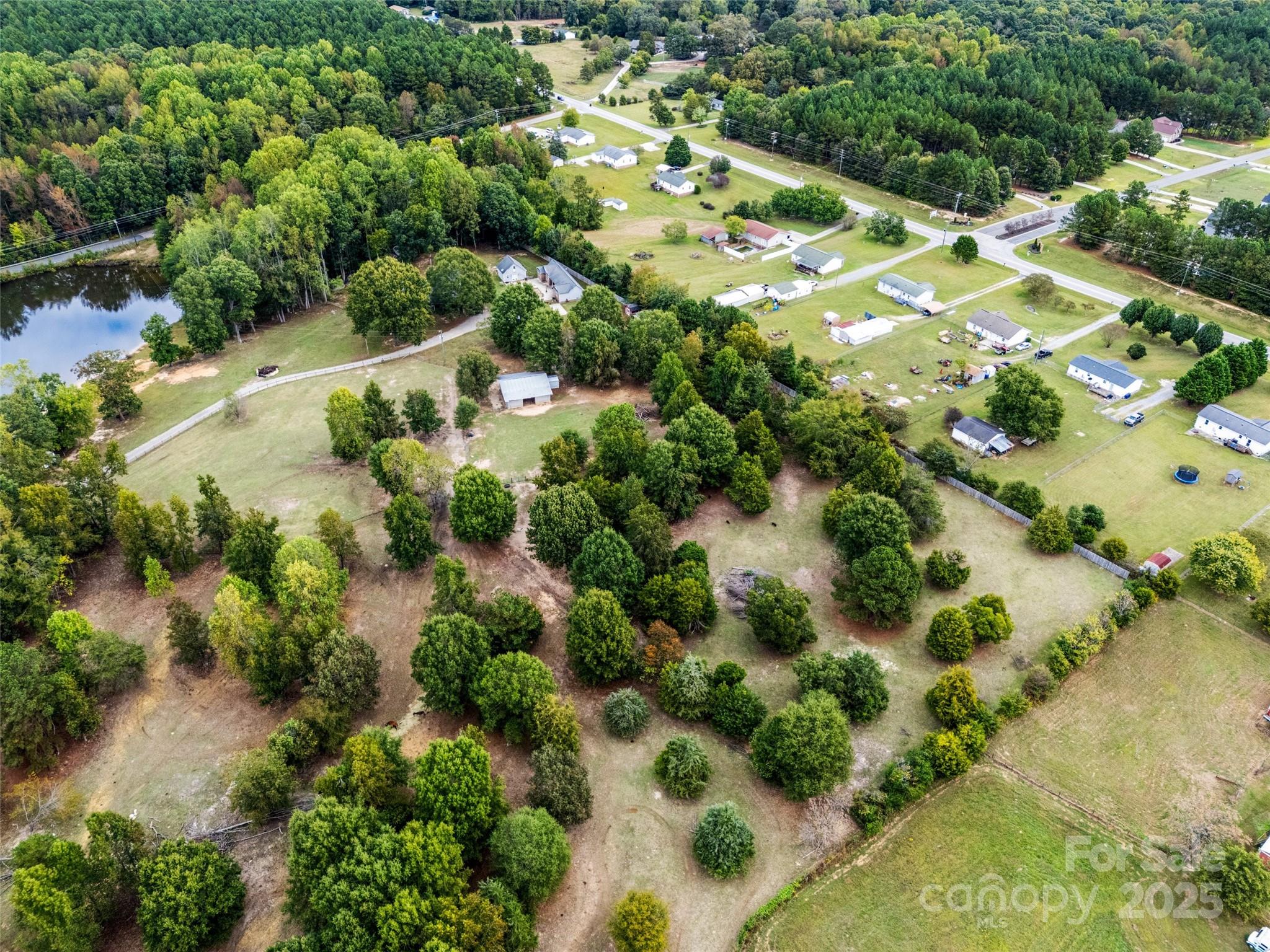 1845 State Rd S-46-149 Clover, SC 29710 - Photo 42 of 48 an aerial view of residential houses with outdoor space and trees