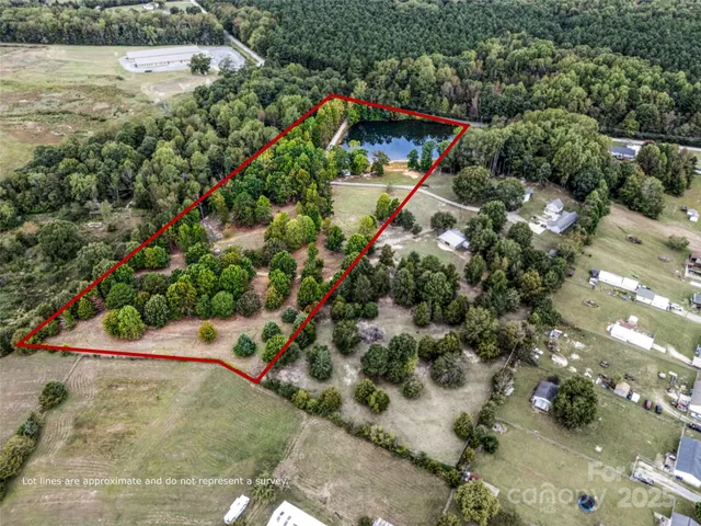 a view of a wooden house with a yard