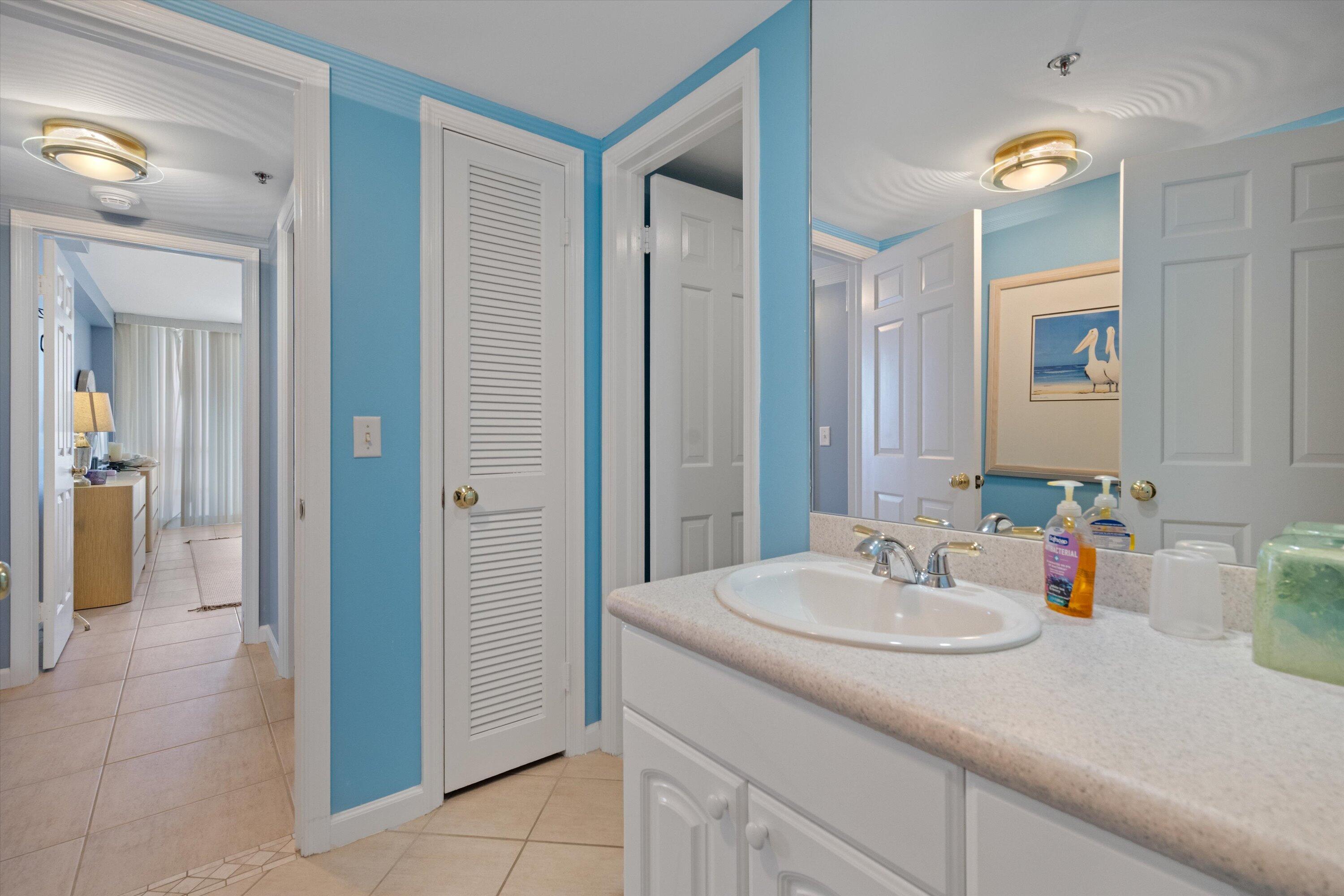 100 South Beach Road, Unit 702 Jupiter, FL 33469 - Photo 17 of 36 a bathroom with a sink and a mirror