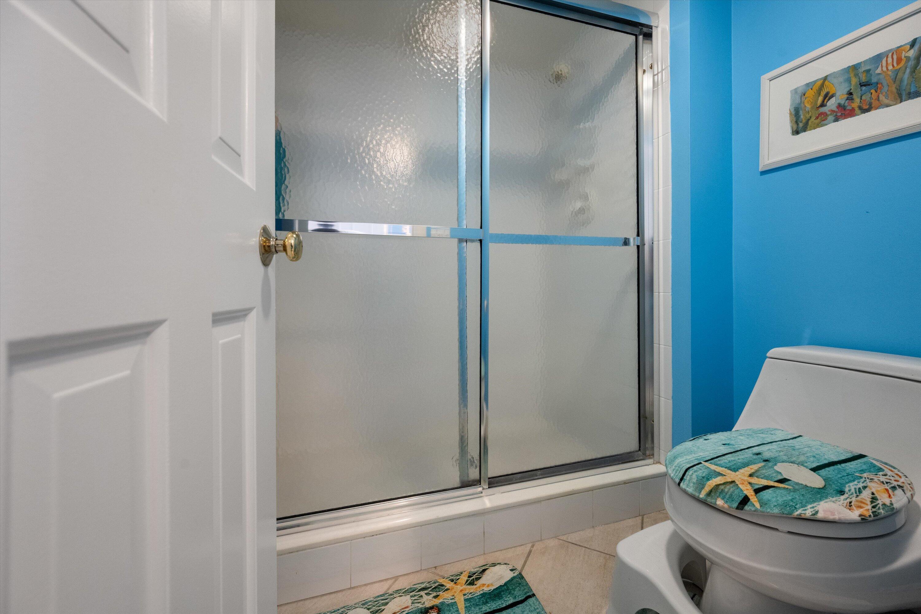 100 South Beach Road, Unit 702 Jupiter, FL 33469 - Photo 18 of 36 a bathroom with a sink and a shower