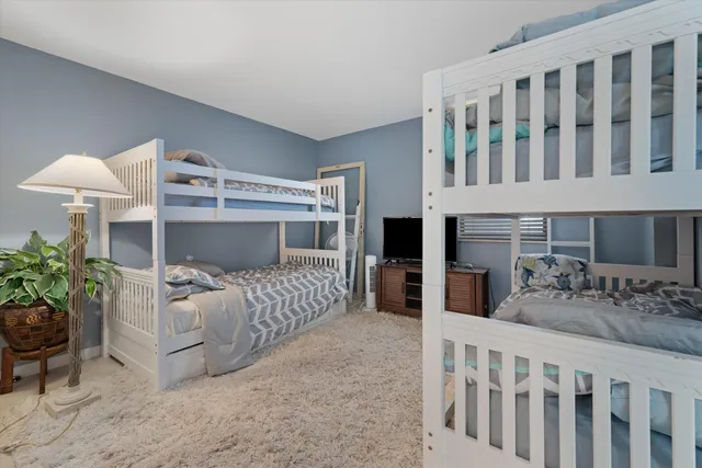 a bedroom with furniture and white walls