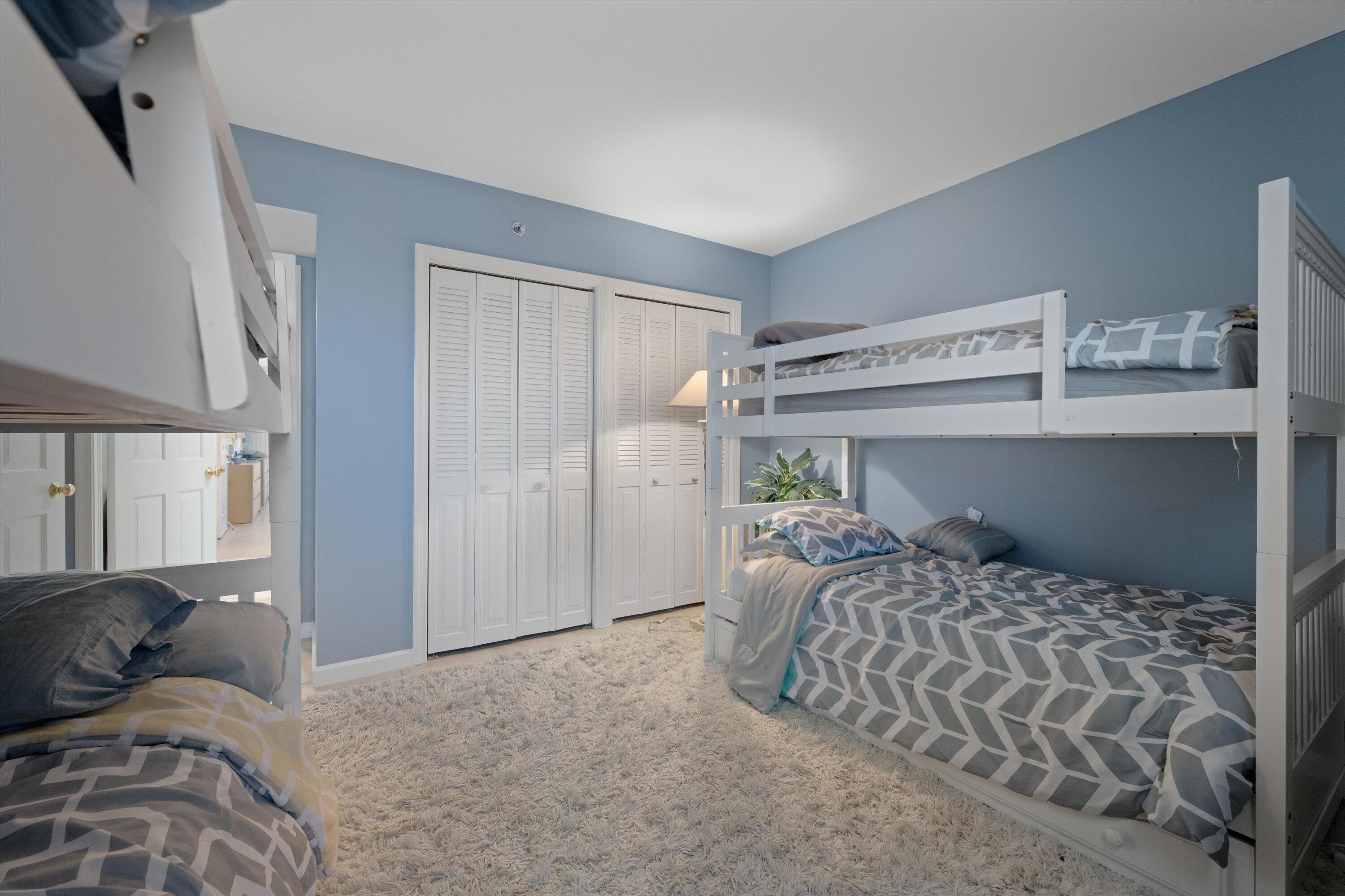 100 South Beach Road, Unit 702 Jupiter, FL 33469 - Photo 20 of 36 a bedroom with a large bed and a window