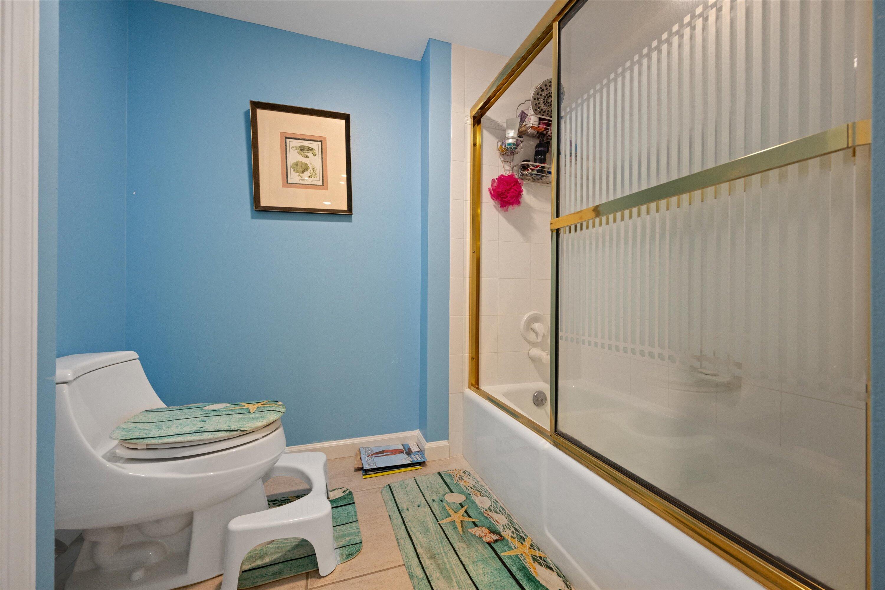 100 South Beach Road, Unit 702 Jupiter, FL 33469 - Photo 24 of 36 a bathroom with a toilet and a shower