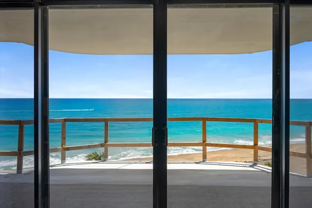 a view of a balcony with an ocean view