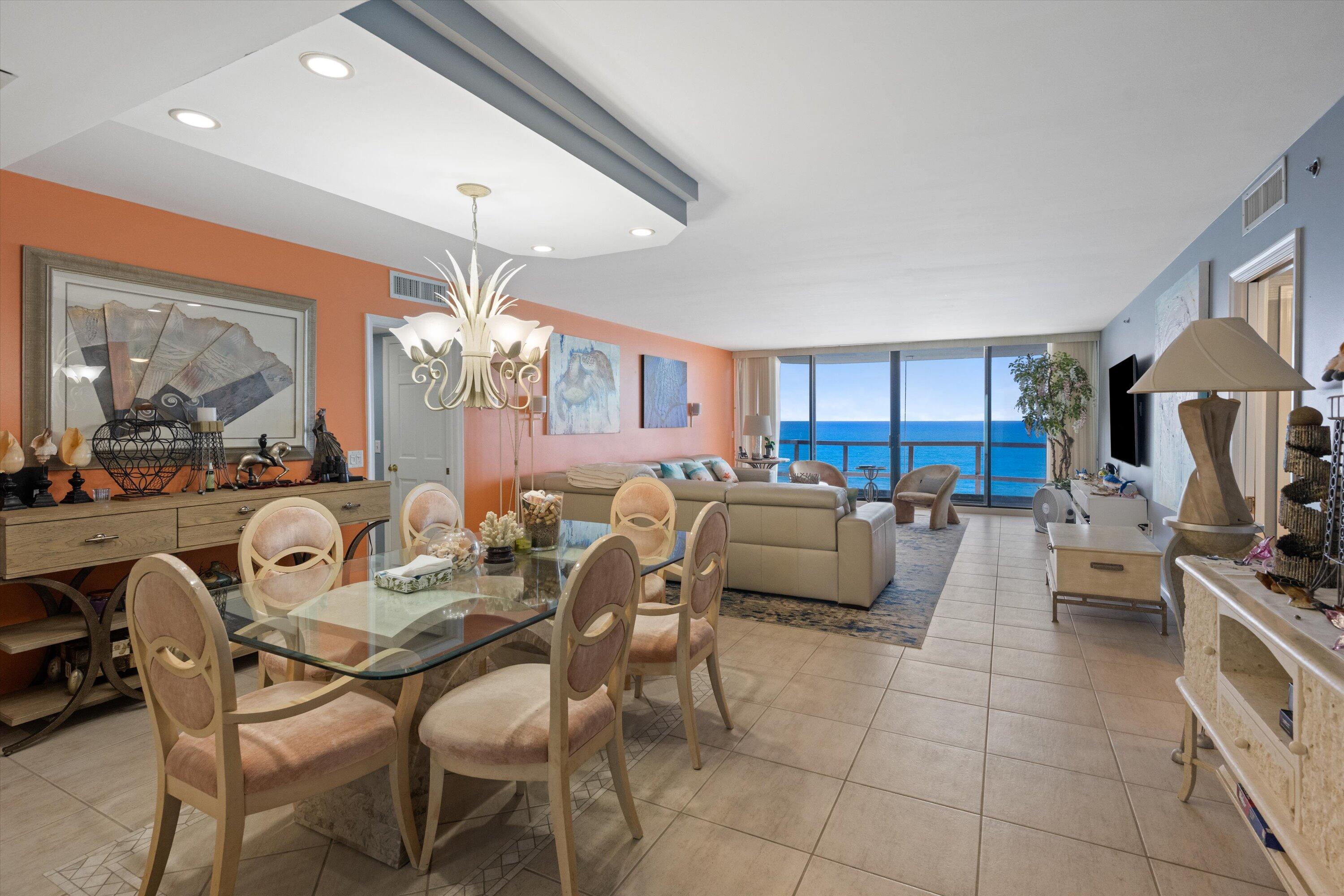 100 South Beach Road, Unit 702 Jupiter, FL 33469 - Photo 5 of 36 a dining room with furniture a chandelier and wooden floor