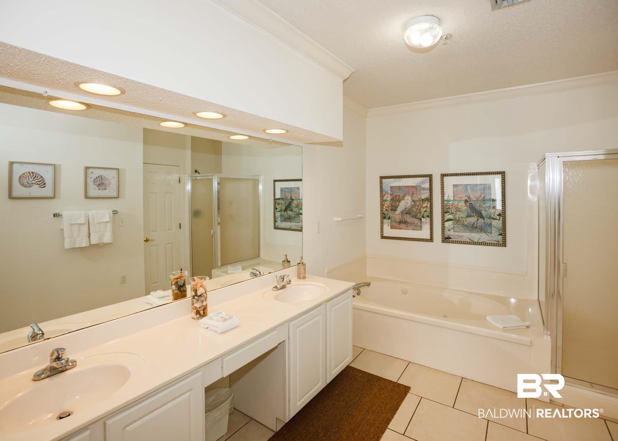 28910 Perdido Beach Boulevard, Unit 4B Orange Beach, AL 36561 - Photo 23 of 48 Full bath featuring tile patterned flooring, a sink, ornamental molding, and a shower stall