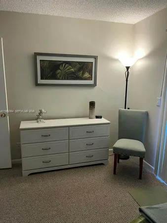 a room with furniture and a lamp