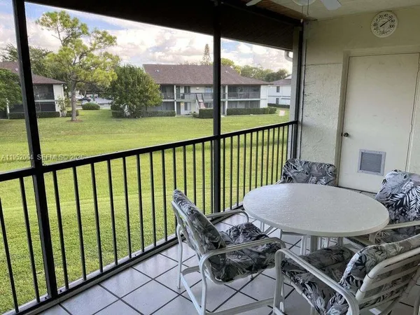 a view of outdoor space with deck and yard