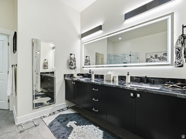 1154 Sunset Dunes Way Draper, UT 84020 - Photo 27 of 50 Full bathroom featuring double vanity, a marble finish shower, and light tile patterned flooring