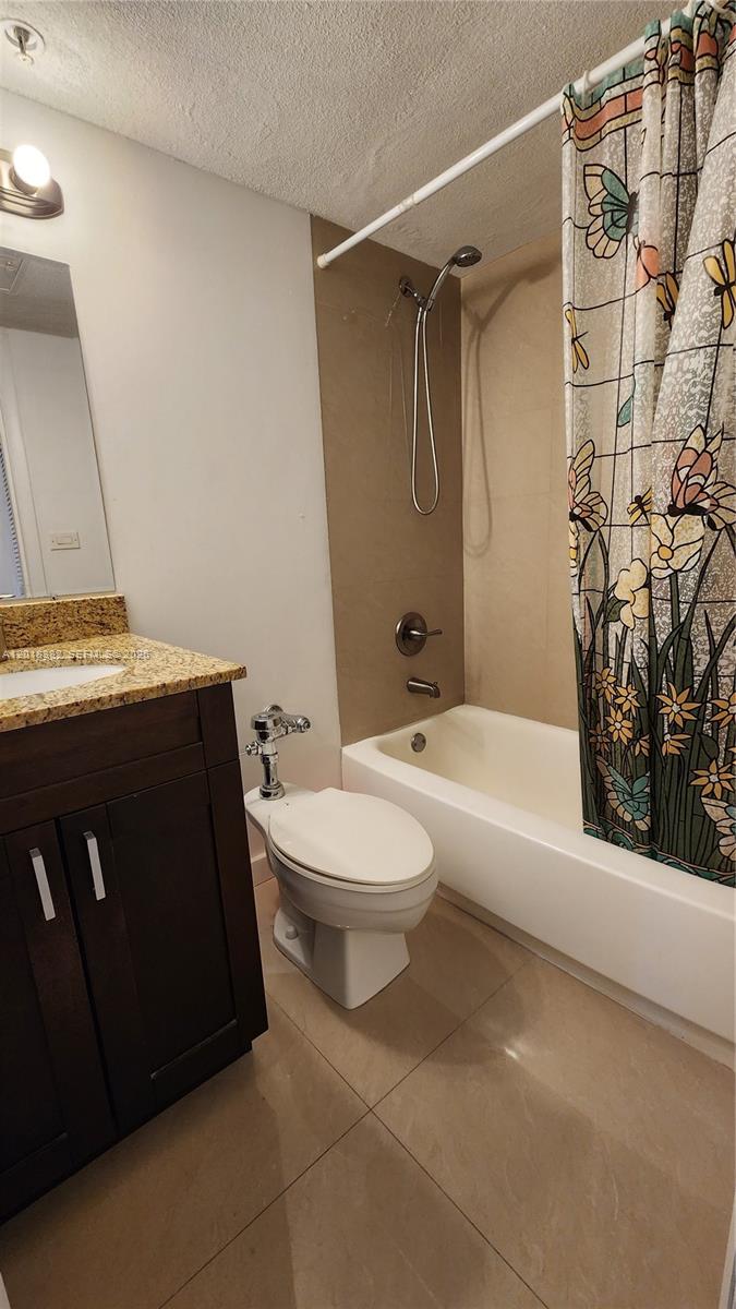 1500 Bay Road, Unit 1550S Miami Beach, FL 33139 - Photo 11 of 16 a bathroom with a toilet a sink and bathtub