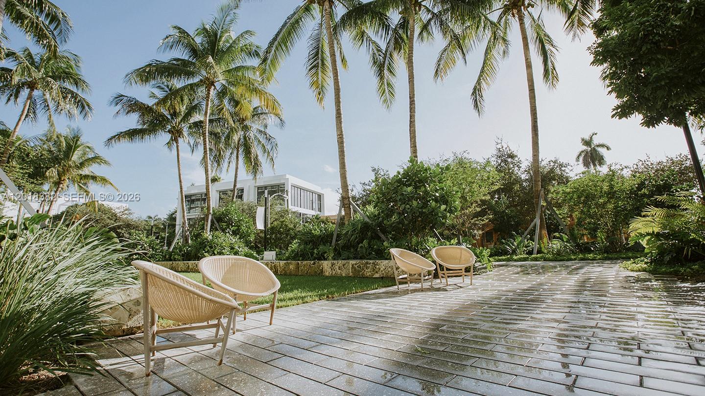 1500 Bay Road, Unit 1550S Miami Beach, FL 33139 - Photo 14 of 16 a view of a table and chairs in patio