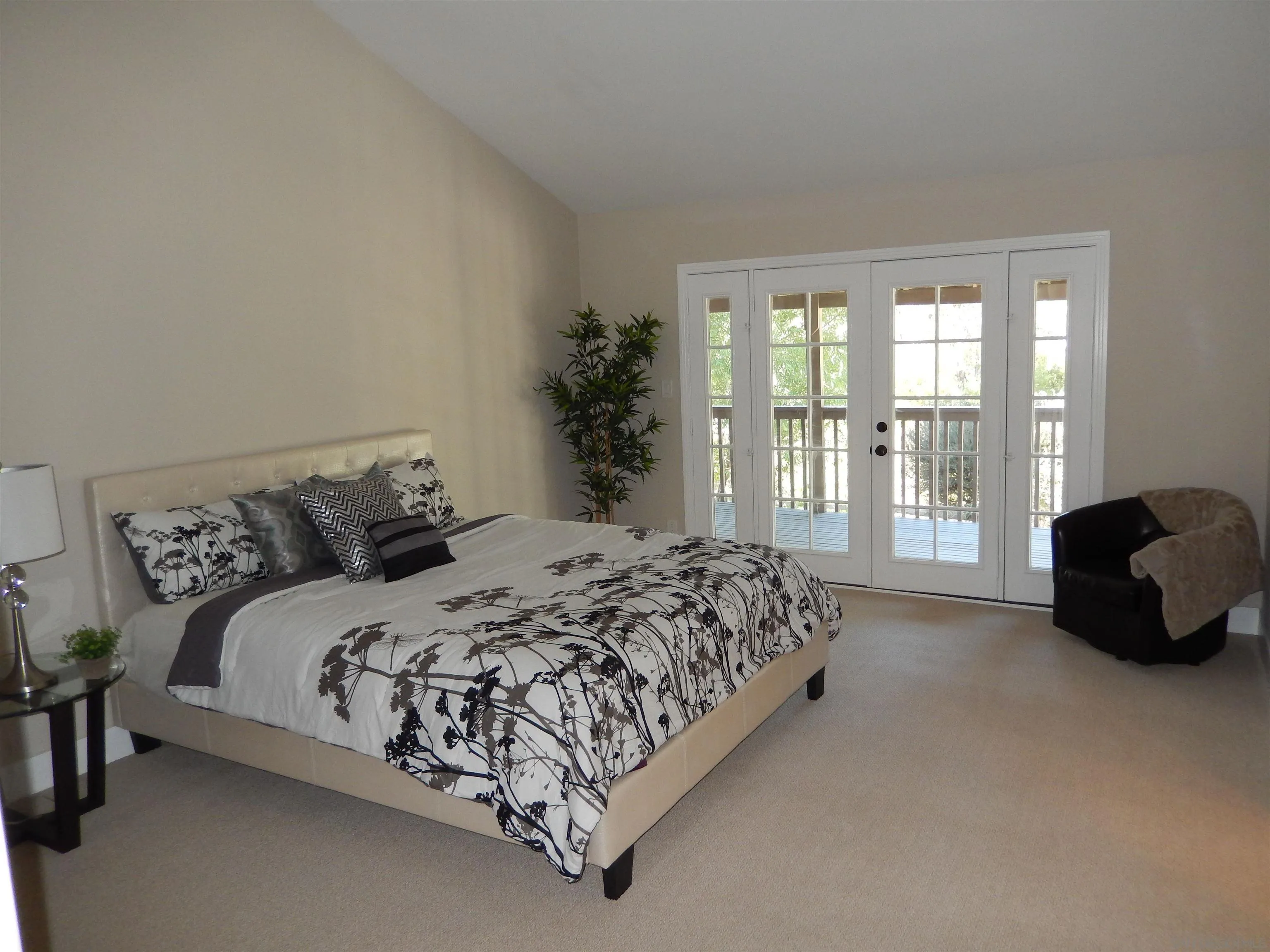 4959 Sleeping Indian Road Fallbrook, CA 92028 - Photo 11 of 22 a bedroom with a bed and a couch next to a window