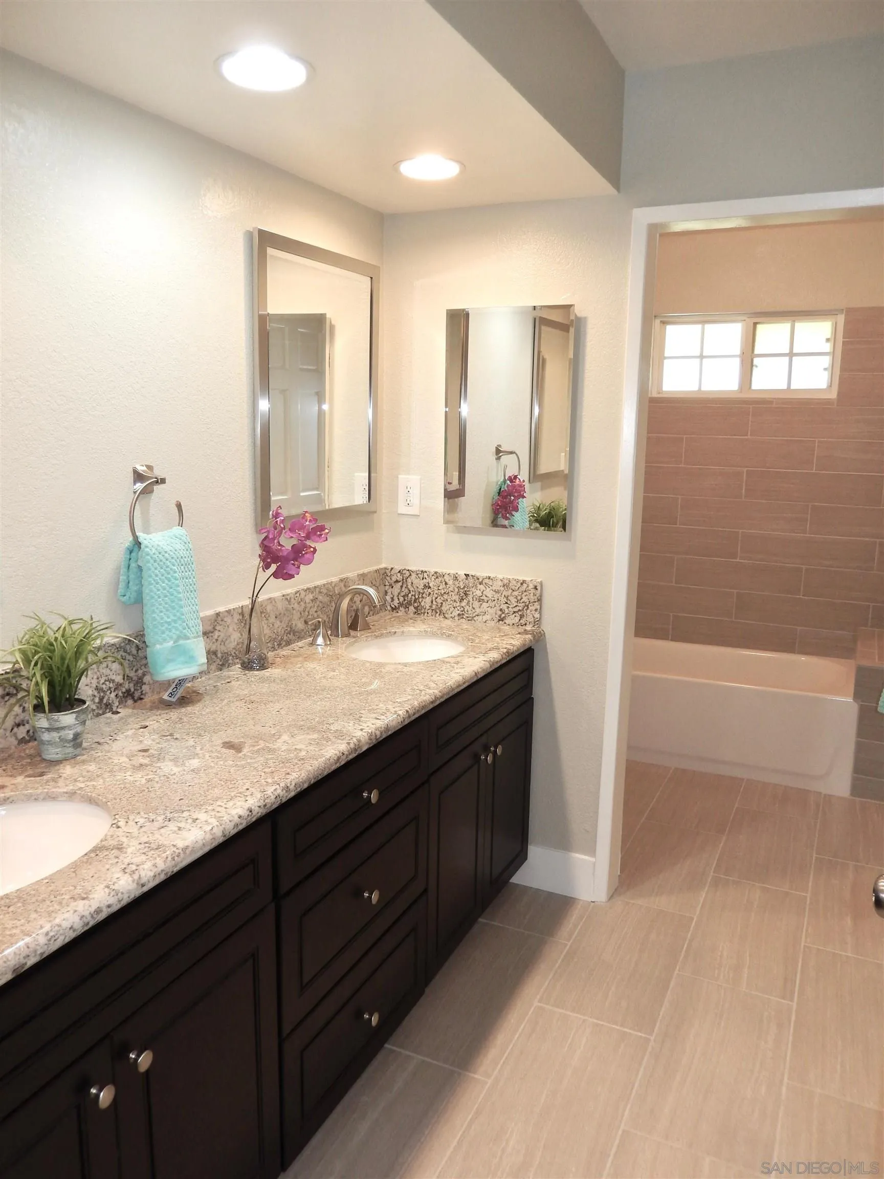 4959 Sleeping Indian Road Fallbrook, CA 92028 - Photo 14 of 22 a bathroom with a granite countertop sink and a mirror