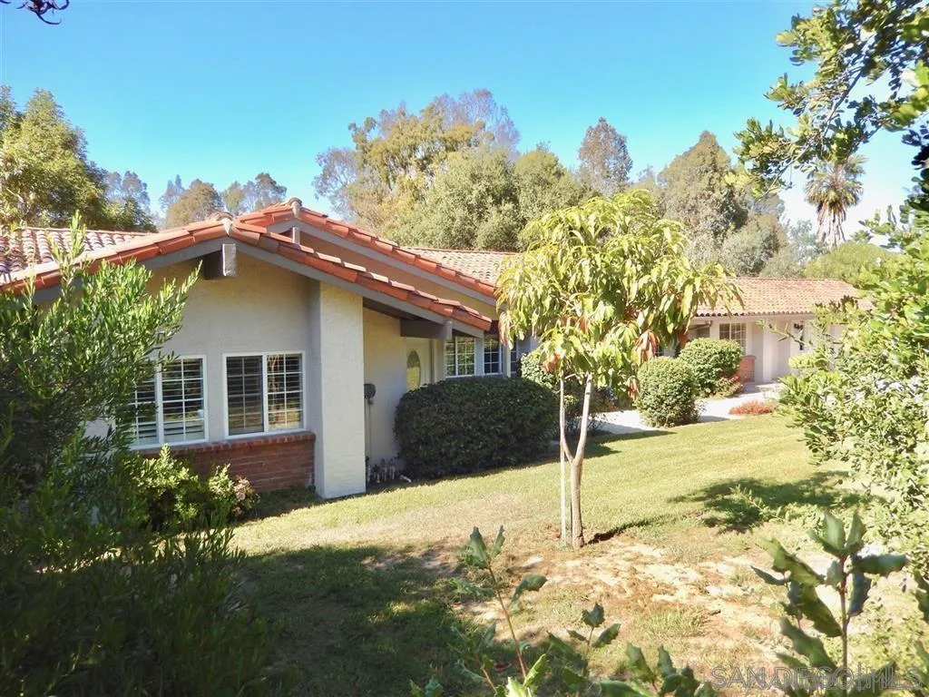 4959 Sleeping Indian Road Fallbrook, CA 92028 - Photo 2 of 22 a house with trees in the background