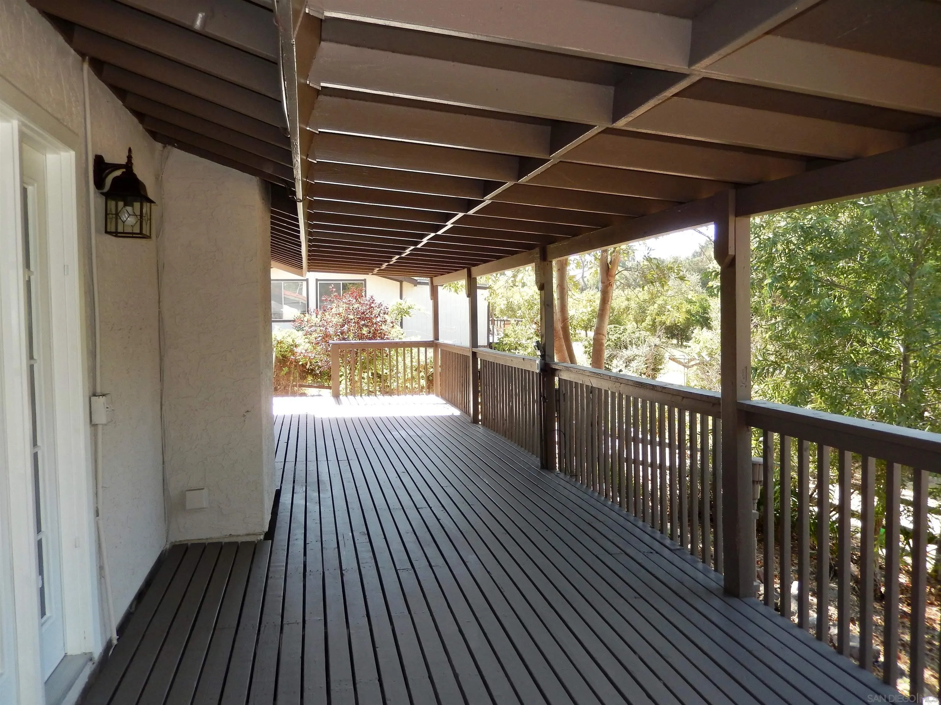 4959 Sleeping Indian Road Fallbrook, CA 92028 - Photo 21 of 22 a view of a porch with wooden floor