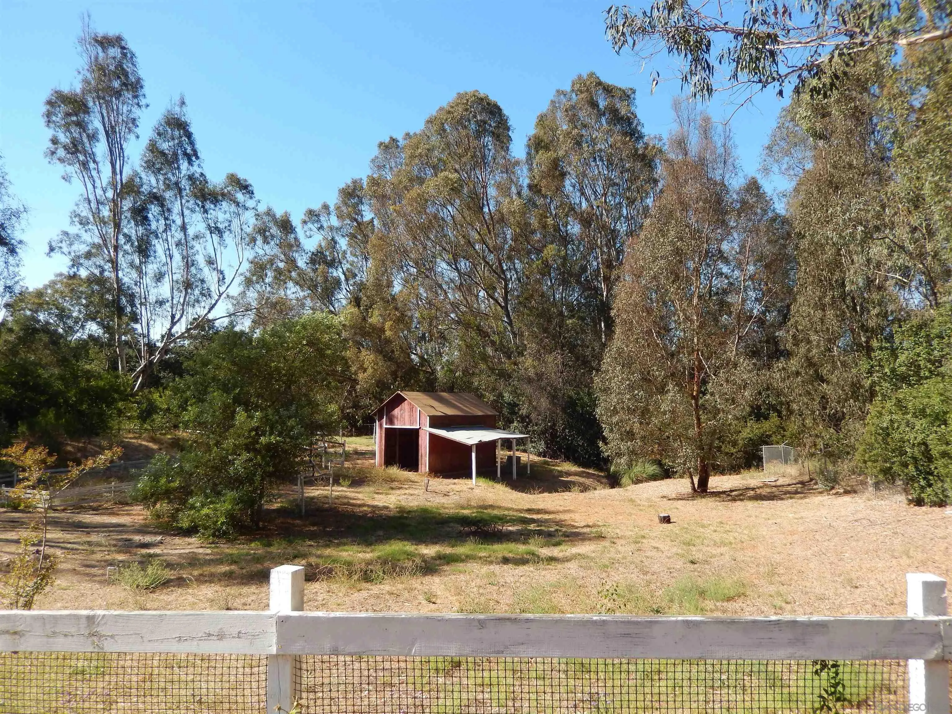 4959 Sleeping Indian Road Fallbrook, CA 92028 - Photo 22 of 22 a view of a yard with a house