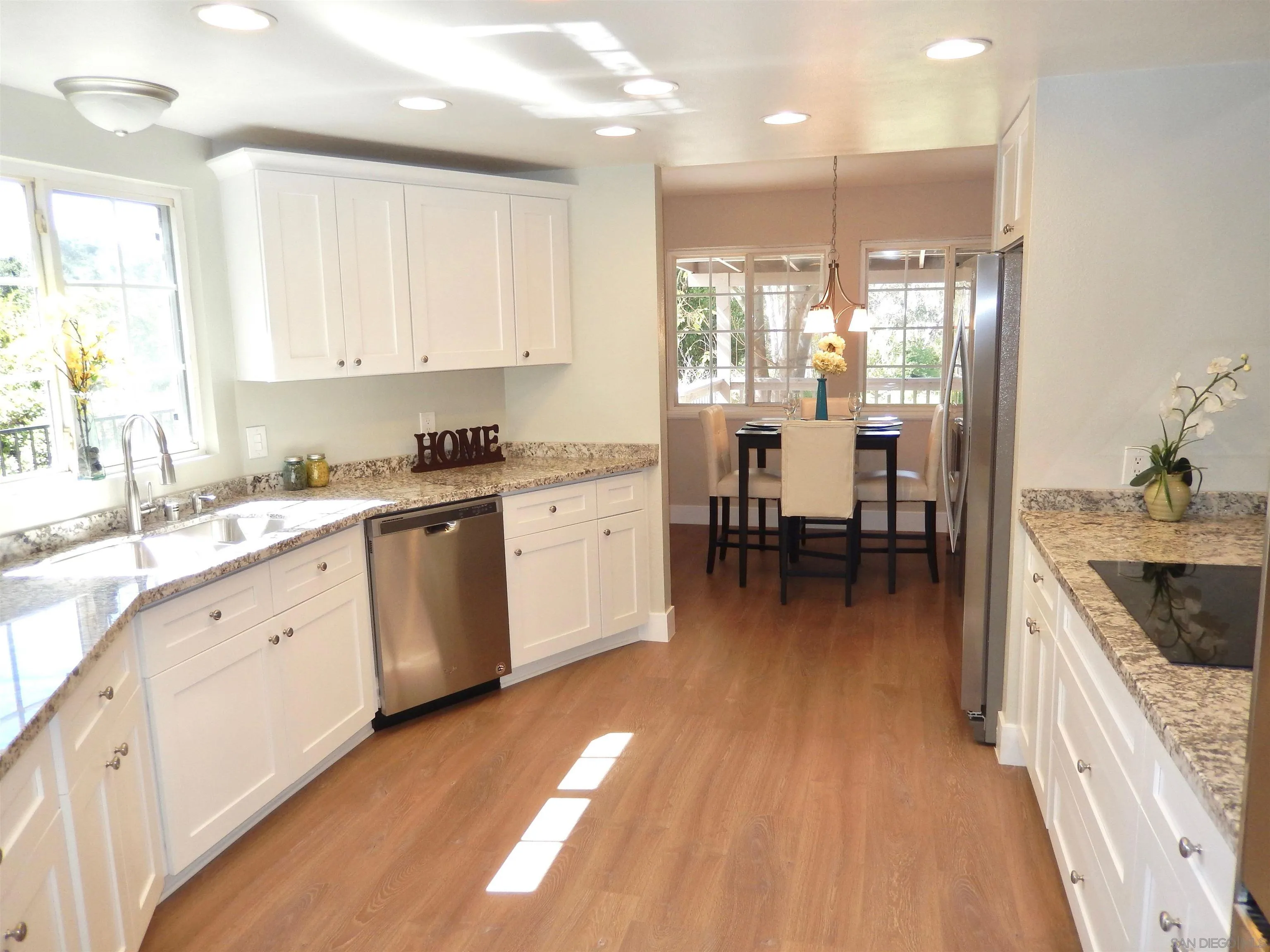 4959 Sleeping Indian Road Fallbrook, CA 92028 - Photo 5 of 22 a kitchen with a sink microwave and cabinets