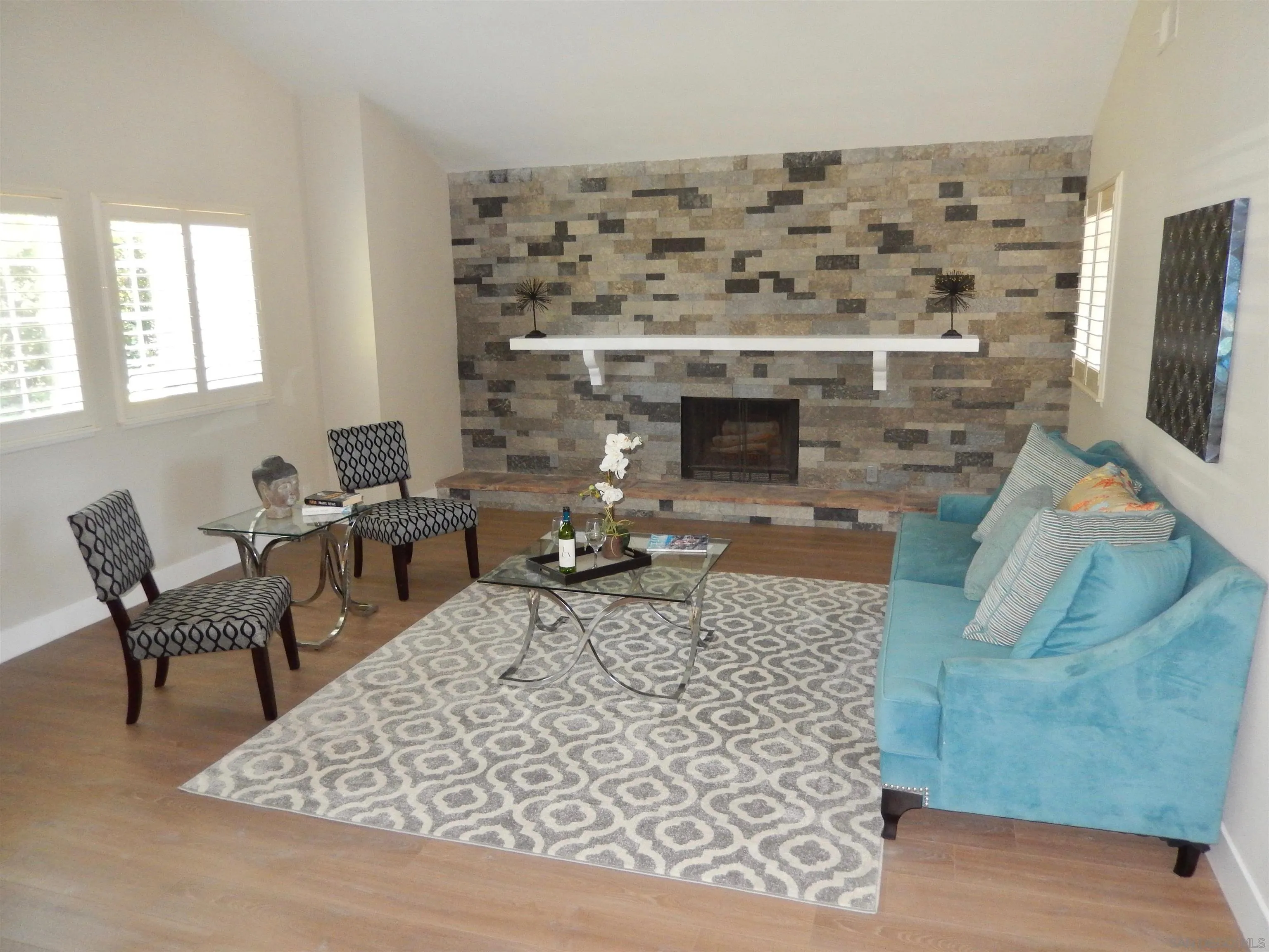 4959 Sleeping Indian Road Fallbrook, CA 92028 - Photo 9 of 22 a living room with furniture a fireplace and a flat screen tv