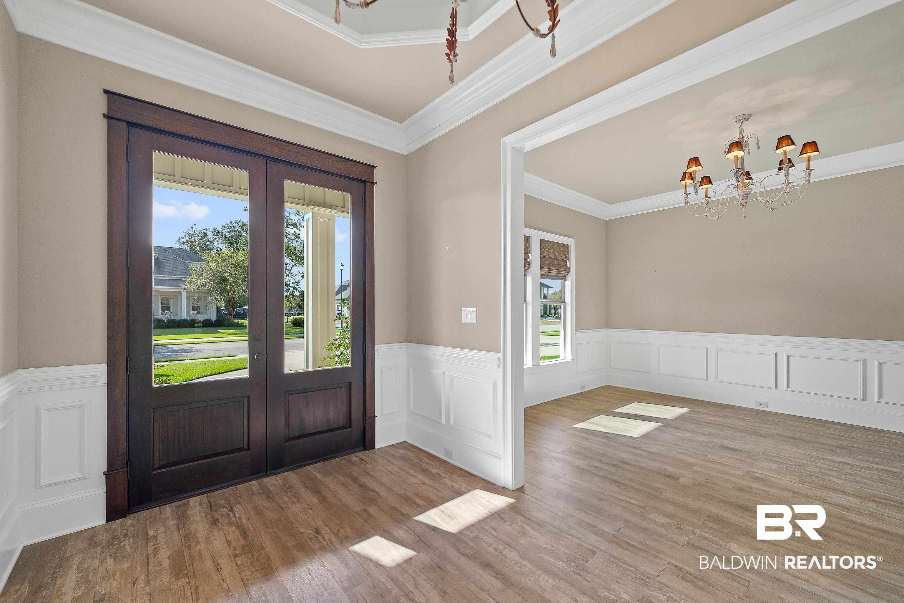 17663 Burwick Loop Fairhope, AL 36532 - Photo 7 of 41 Foyer entrance with ornamental molding, a chandelier, and light hardwood / wood-style floors