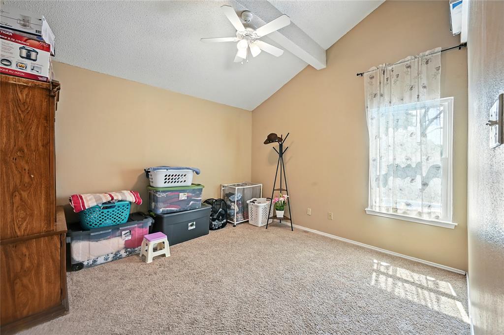 7741 Misty Ridge Drive North Fort Worth, TX 76137 - Photo 20 of 29 a bedroom with furniture and a window