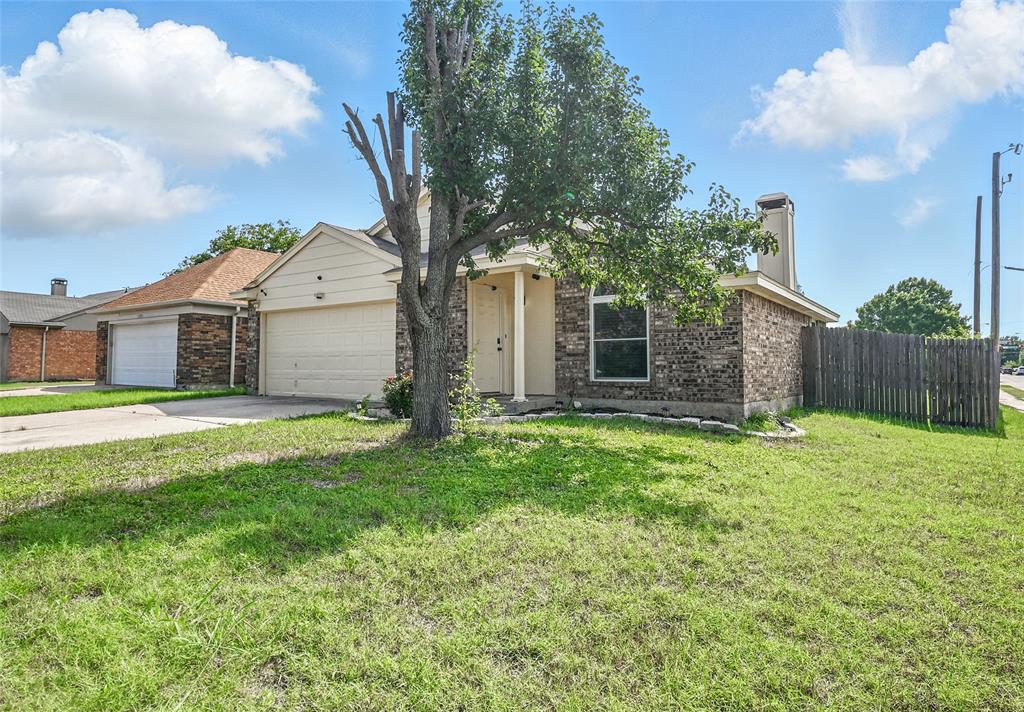7741 Misty Ridge Drive North Fort Worth, TX 76137 - Photo 3 of 29 a front view of a house with garden