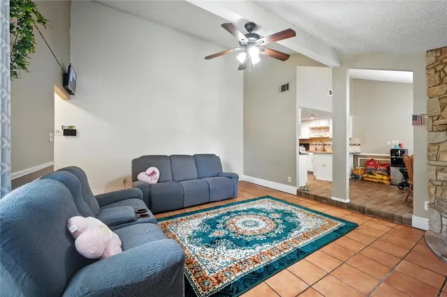 a living room with furniture rug and window