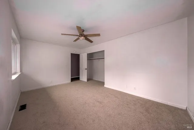 a view of a big room with carpet