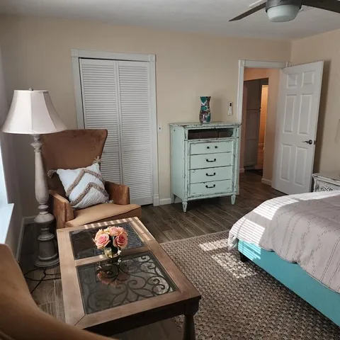 a bed room with a bed and a tv