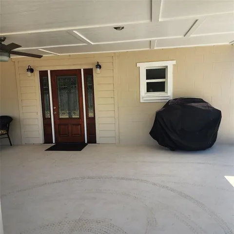 a view of an empty room and fire place