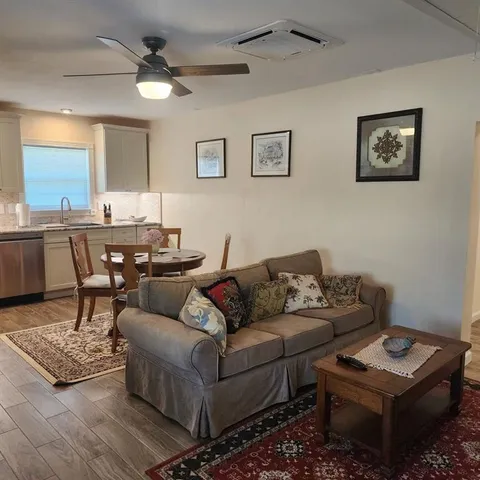 a living room with furniture and a table