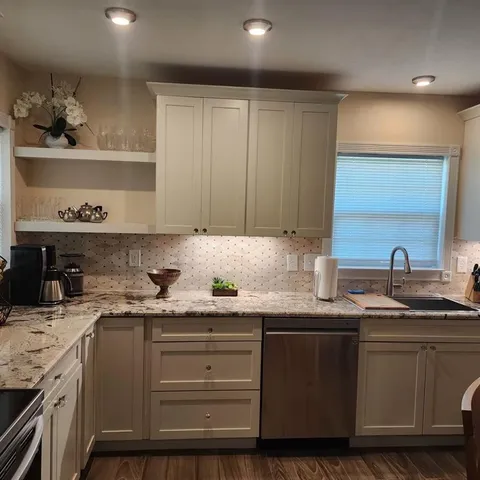 a kitchen with a sink and cabinets