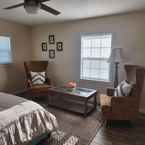 a bedroom with furniture and window