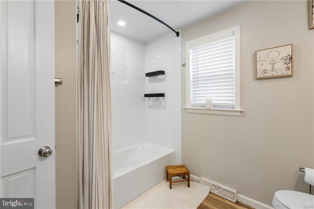 2051 Reading Avenue Reading, PA 19609 - Photo 13 of 45 a bathroom with a bathtub a toilet and a shower