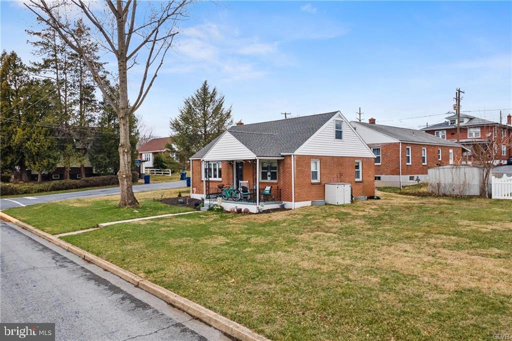 2051 Reading Avenue Reading, PA 19609 - Photo 2 of 45 a front view of a house with garden